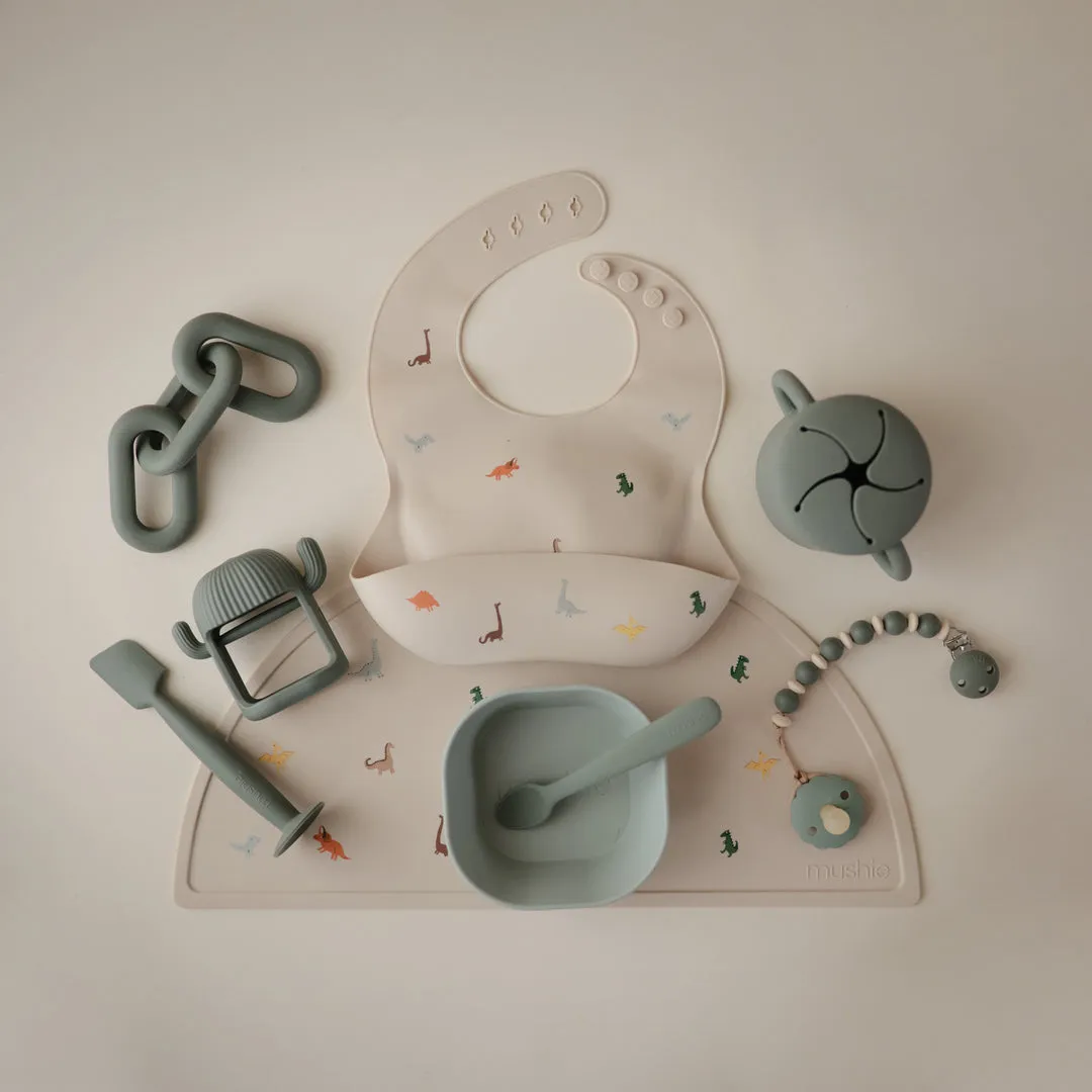 Mushie Silicone Baby Bib | Dinosaurs